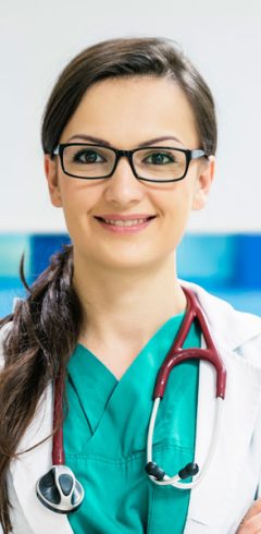 smiling-beautiful-doctor-at-hospital-standing-M24WXKH